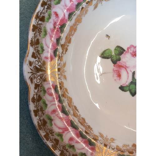 820 - A Welsh Nantgarw porcelain bowl, 19th century, the well with central rose spray, gilt and rose friez... 