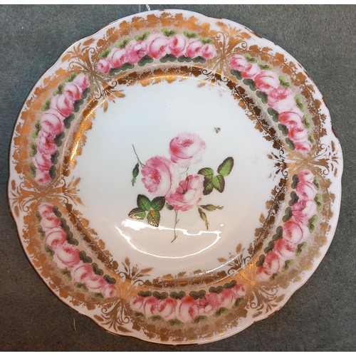 820 - A Welsh Nantgarw porcelain bowl, 19th century, the well with central rose spray, gilt and rose friez... 