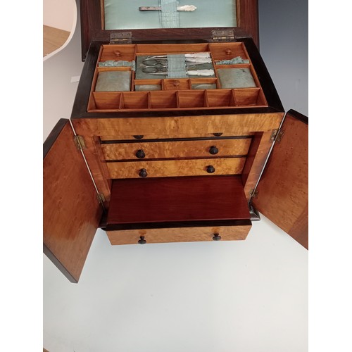 1077 - A William IV rosewood table top work box, the sarcophagus shaped hinged cover applied with moulded b... 