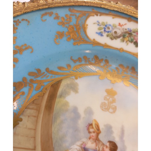 788 - A Sevres Chateau des Tuileries ormolu mounted tazza, 19th century, the well painted with a courting ... 