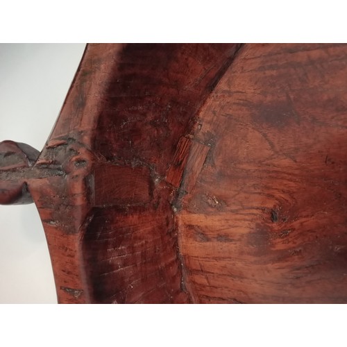 571 - A 19th century dairy bowl, probably elm, the angular lug handles with roundel grips, 42cm diameter, ... 