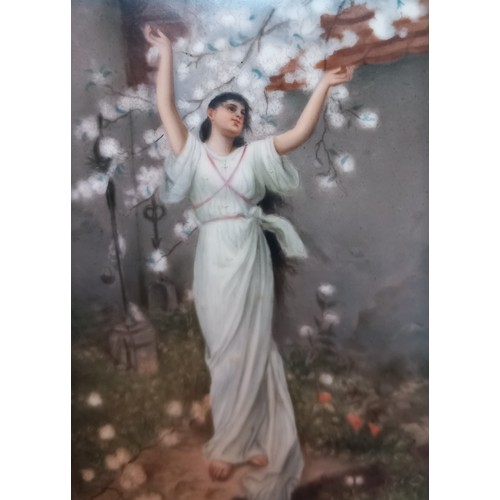 794 - A French porcelain plaque, late 19th century, depicting a classical maiden beneath a prunus tree, wi... 