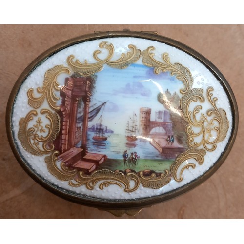 482 - A porcelain oval box, 19th century,  the hinged cover enamelled with a central harbour landscape and... 