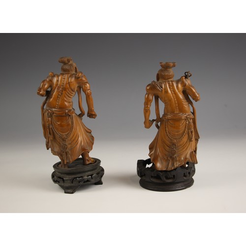 747 - A pair of Chinese carved boxwood figures, late 19th/early 20th century, each modelled as an immortal... 