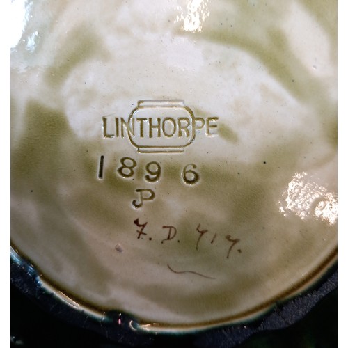 824 - A Linthorpe glazed earthenware plate, 19th century, pierced border with flowers, makers mark to base... 