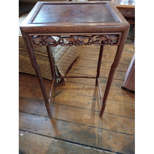 1210 - A nest of three Chinese rosewood tables, 20th century, of rectangular form, with a carved vinery ope... 