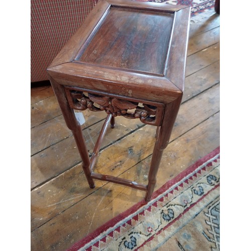 1210 - A nest of three Chinese rosewood tables, 20th century, of rectangular form, with a carved vinery ope... 