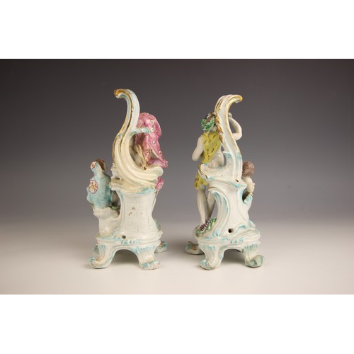 804 - A pair of English porcelain figural groups, 18th century, modelled as man warming his hands to a fir... 