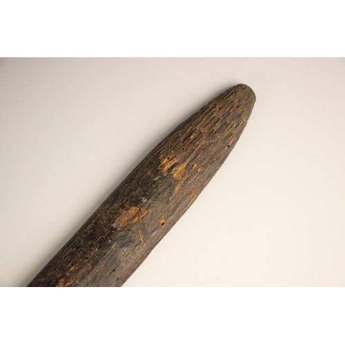 935 - A Papua New Guinea palm wood paddle club, 123cm long, with a Papua New Guinea palm wood bow with bam... 