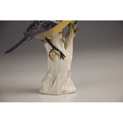 807 - A Meissen porcelain model of a Great Tit, 19th century, perched upon a branch with gilt highlights, ... 