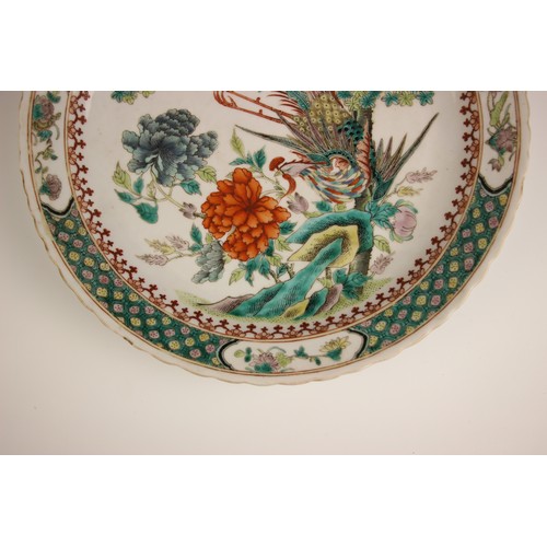 725 - A pair of Chinese porcelain famille verte porcelain plates, 19th century in the Kangxi style, each c... 