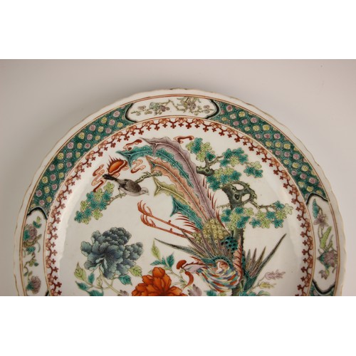 725 - A pair of Chinese porcelain famille verte porcelain plates, 19th century in the Kangxi style, each c... 