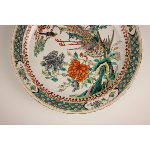 725 - A pair of Chinese porcelain famille verte porcelain plates, 19th century in the Kangxi style, each c... 