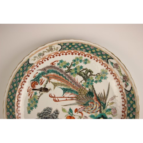 725 - A pair of Chinese porcelain famille verte porcelain plates, 19th century in the Kangxi style, each c... 