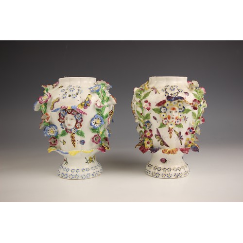 798 - A pair of Bow porcelain potpourri 'frill' vases, circa 1764, each high shouldered vase decorated wit... 