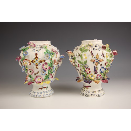 798 - A pair of Bow porcelain potpourri 'frill' vases, circa 1764, each high shouldered vase decorated wit... 