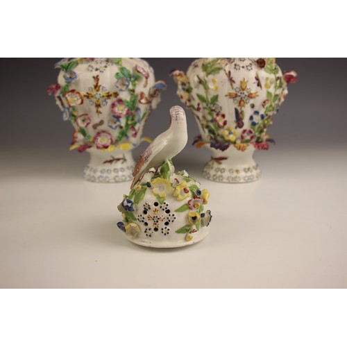 798 - A pair of Bow porcelain potpourri 'frill' vases, circa 1764, each high shouldered vase decorated wit... 