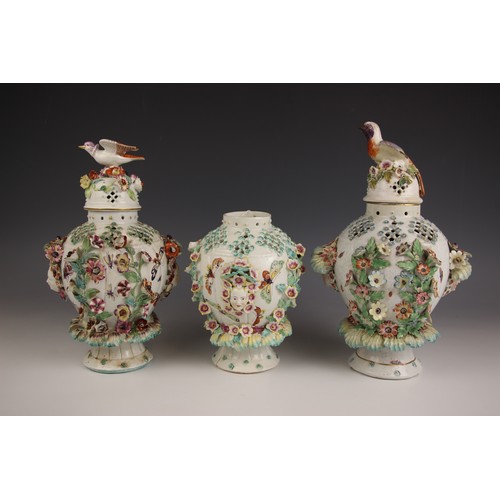 809 - Three Derby porcelain potpourri 'Frill' vases, circa 1764, the high shouldered bodies with pierced l... 