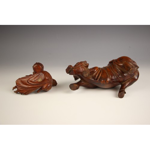 723 - A Chinese carved wood model of a buffalo, late 19th century, modelled with a boy on his back, 12cm h... 