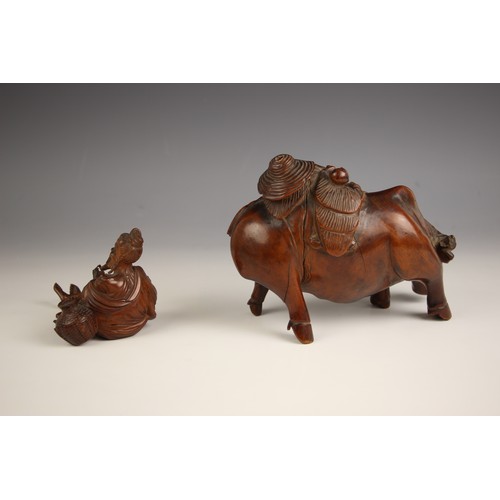 723 - A Chinese carved wood model of a buffalo, late 19th century, modelled with a boy on his back, 12cm h... 