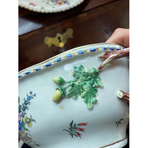 811 - A continental porcelain tureen, cover and stand, 20th century, decorated with floral and foliate spr... 