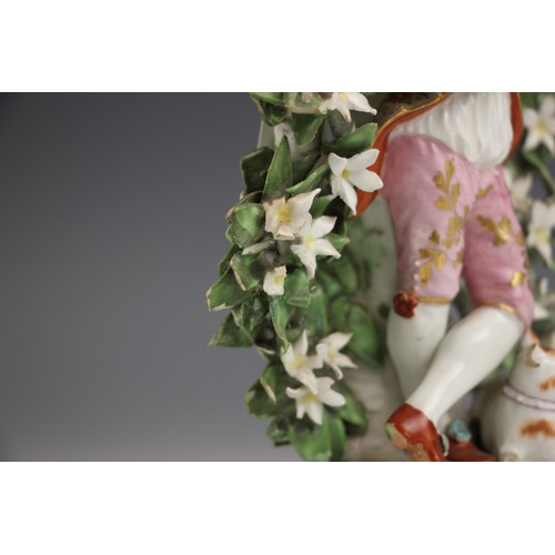 805 - A near pair of English porcelain figures, 18th century, one modelled as a young gentleman in classic... 