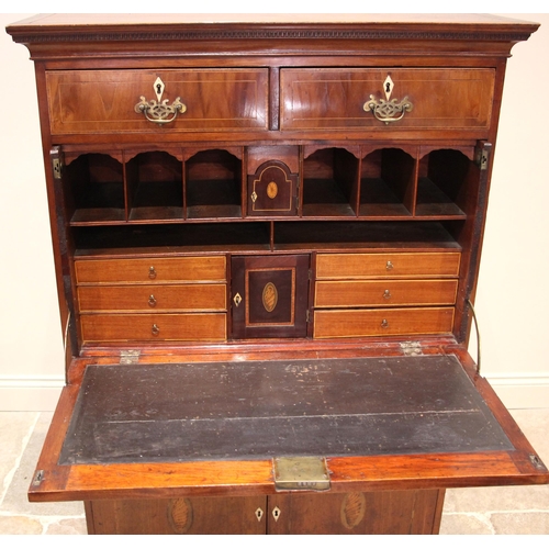 1002 - A continental walnut, mahogany and marquetry secretaire abattant, early 19th century, the dentil cor... 