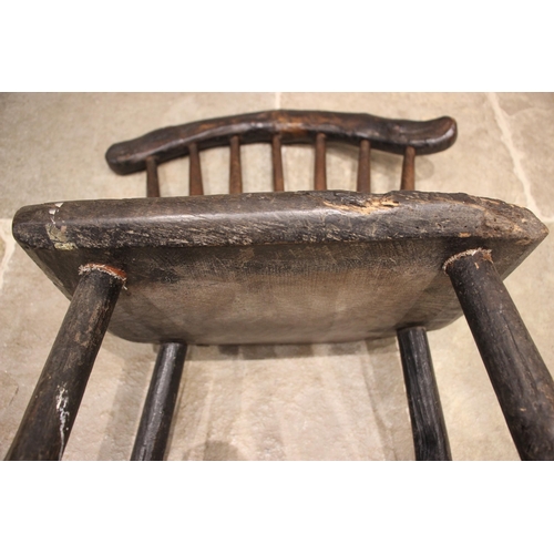 1005 - A small Welsh primitive oak comb back chair, early 19th century, the rough cut crescent shaped top r... 