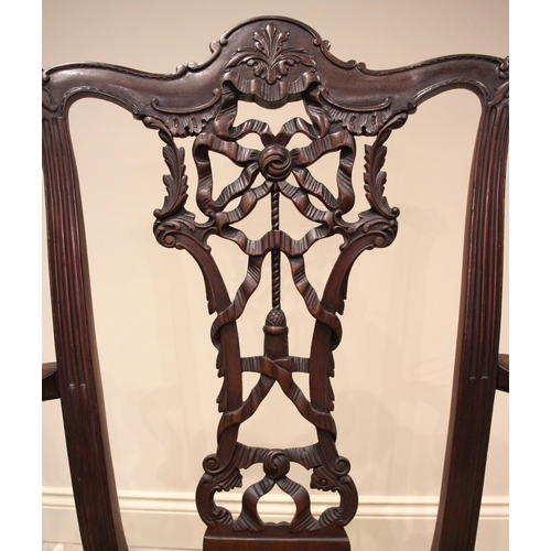 1012 - A set of eight mahogany Chippendale style dining chairs, early 20th century, each with a ribbon tied... 