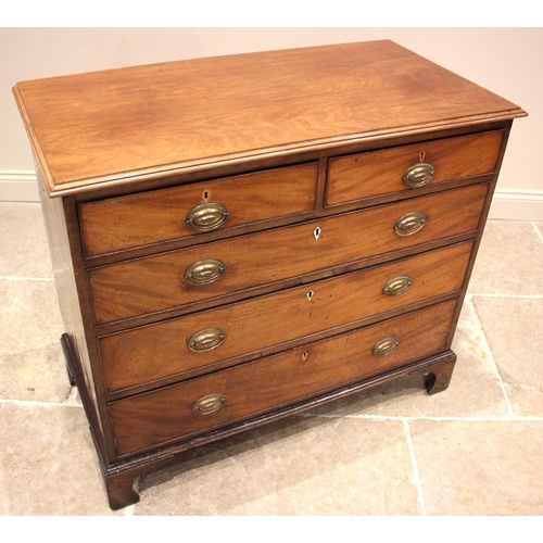 1021 - A George III mahogany chest of drawers, the moulded top over an arrangement of two short and three l... 