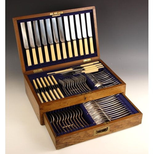 103 - An oak canteen of silver plated Old English pattern cutlery, comprising twelve dessert forks, nine t... 