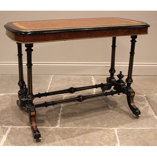 1058 - A Victorian ebonised satinwood and amboyna occasional table, the rounded rectangular top with a cent... 