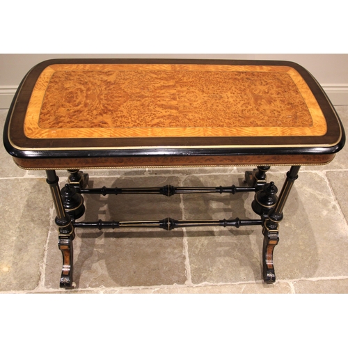 1058 - A Victorian ebonised satinwood and amboyna occasional table, the rounded rectangular top with a cent... 