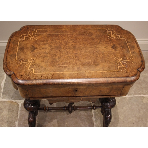 1062 - A Victorian burr walnut games/work table, the quarter veneered and marquetry inlaid hinged top, open... 