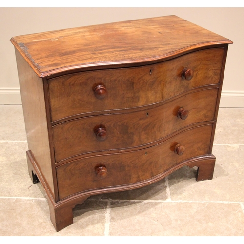 1076 - A 19th century serpentine mahogany chest of drawers, the moulded top over an arrangement of three lo... 