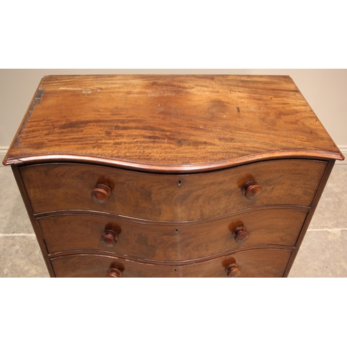 1076 - A 19th century serpentine mahogany chest of drawers, the moulded top over an arrangement of three lo... 