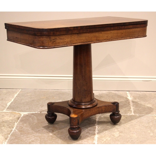 1077 - An early Victorian mahogany tea table, the folding rectangular top with rounded corners, upon a tape... 