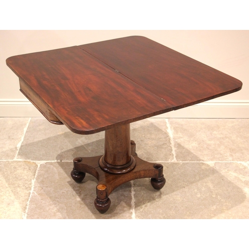 1077 - An early Victorian mahogany tea table, the folding rectangular top with rounded corners, upon a tape... 