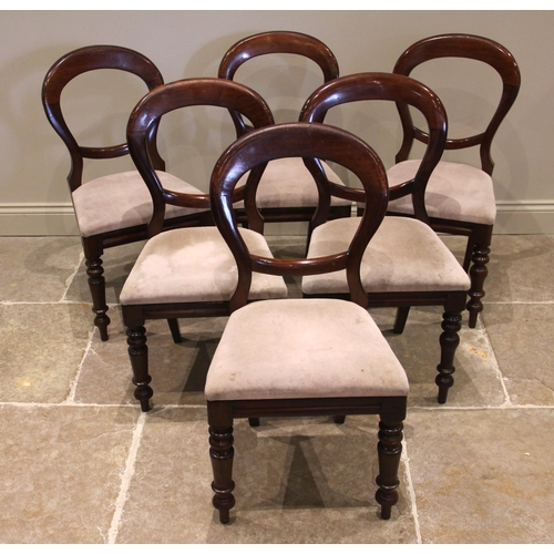 1083 - A set of six Victorian mahogany balloon back dining chairs, each with a drop-in upholstered seat, up... 