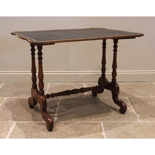 1088 - A 19th century mahogany writing table, the serpentine shaped top inset with a gilt tooled skiver, up... 