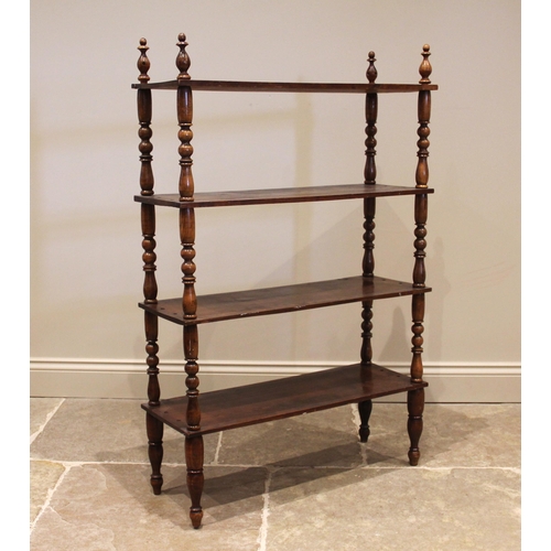 1091 - A Victorian walnut etagere/ bookcase, the four tiers upon baluster and bobbin turned supports, exten... 