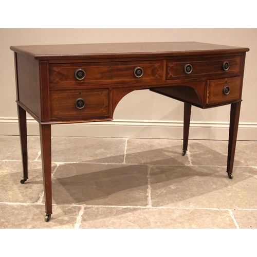 1105 - An Edwardian mahogany bowfront dressing table/desk, formed as an arrangement of four small drawers, ... 