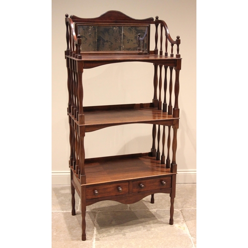 1116 - A mahogany etagere/what not, 20th century, the upper tier with a mirrored back over two further tier... 