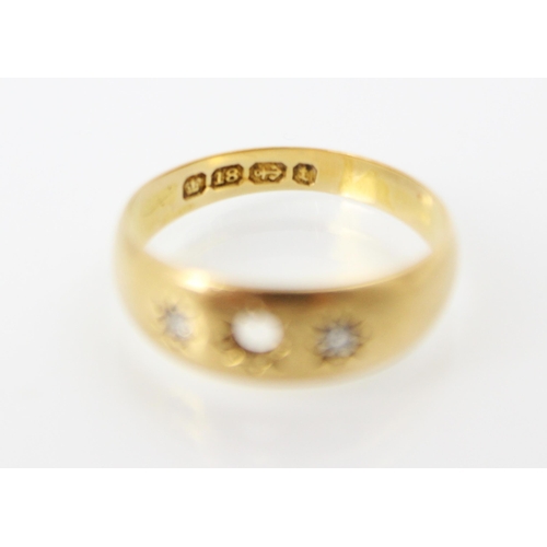 245 - An 18ct yellow gold diamond set gypsy ring, with two old cut diamonds set within engraved star desig... 