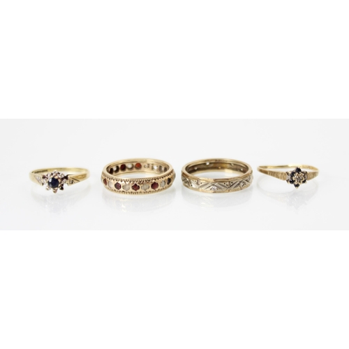 246 - A selection of four yellow metal rings, including a paste set band ring, with engraved white metal b... 