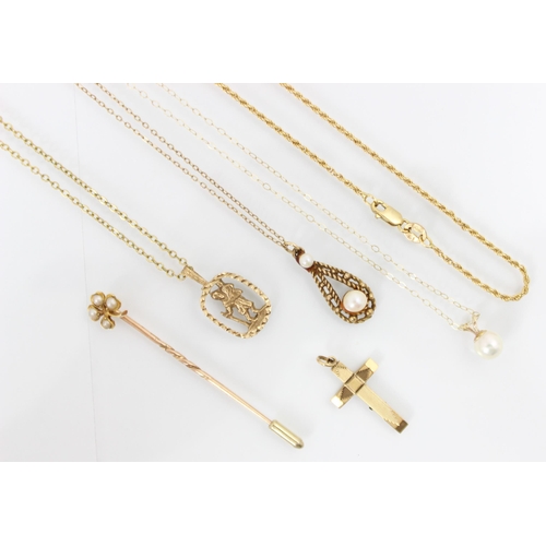 259 - A selection of 9ct yellow gold and yellow metal jewellery, including a 9ct yellow gold cross pendant... 