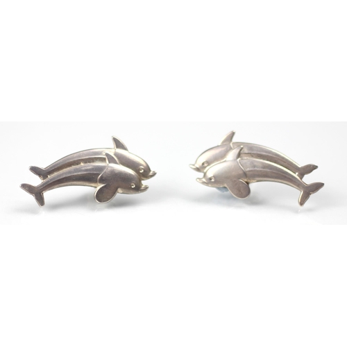 294 - A Georg Jensen dolphin brooch, designed by Arno Malinowski, the two dolphins leaping above stylised ... 