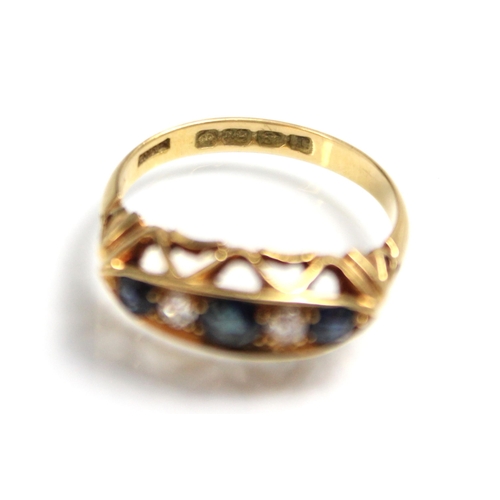 307 - An early 20th century sapphire and diamond five stone ring, the three graduated round cut sapphires ... 