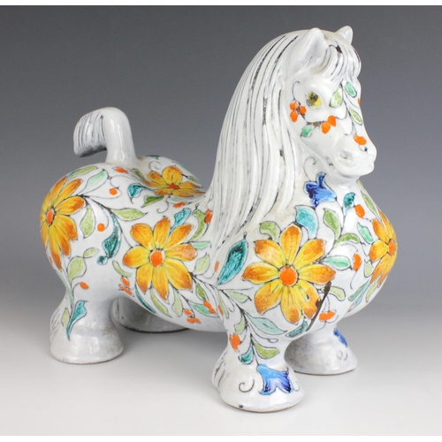 600 - An Italian Mancioli 'Cavallo' earthenware model of a horse, 20th century, extensively decorated with... 