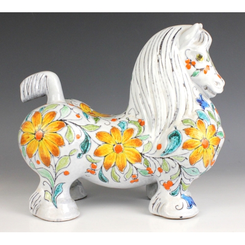 600 - An Italian Mancioli 'Cavallo' earthenware model of a horse, 20th century, extensively decorated with... 